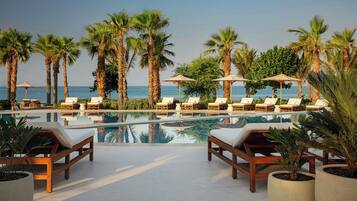 Outdoor pool, free cabanas, pool umbrellas