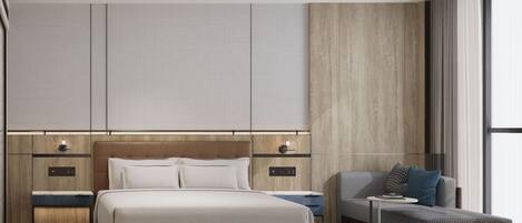 A modern hotel room with a large bed, a sofa, a small table, and a view of the city through large windows.