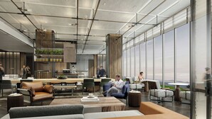 A modern interior with a high ceiling, open-plan layout, and large windows offering views. - Sheraton Kunshan Dianshan Lake (Suzhou)