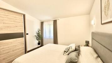 Apartment, 2 Bedrooms, City View | Premium bedding, desk, laptop workspace, free cribs/infant beds