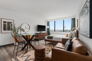 Standard Apartment, 1 Queen Bed, Kitchenette, City View | Desk, laptop workspace, blackout drapes, iron/ironing board