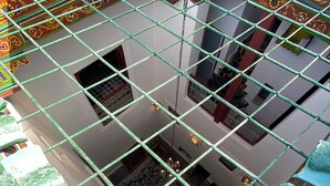A multi-level building with a grid-like structure, possibly a hotel or residential complex. - Riad la Mentha (Fès)