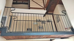 A balcony with a metal railing, wooden beams, and a white awning. - CASA VACANZE UN TOCCO DI ANTICO-RESIDENZA IN UN PALAZZO STORICO. (Tropea)