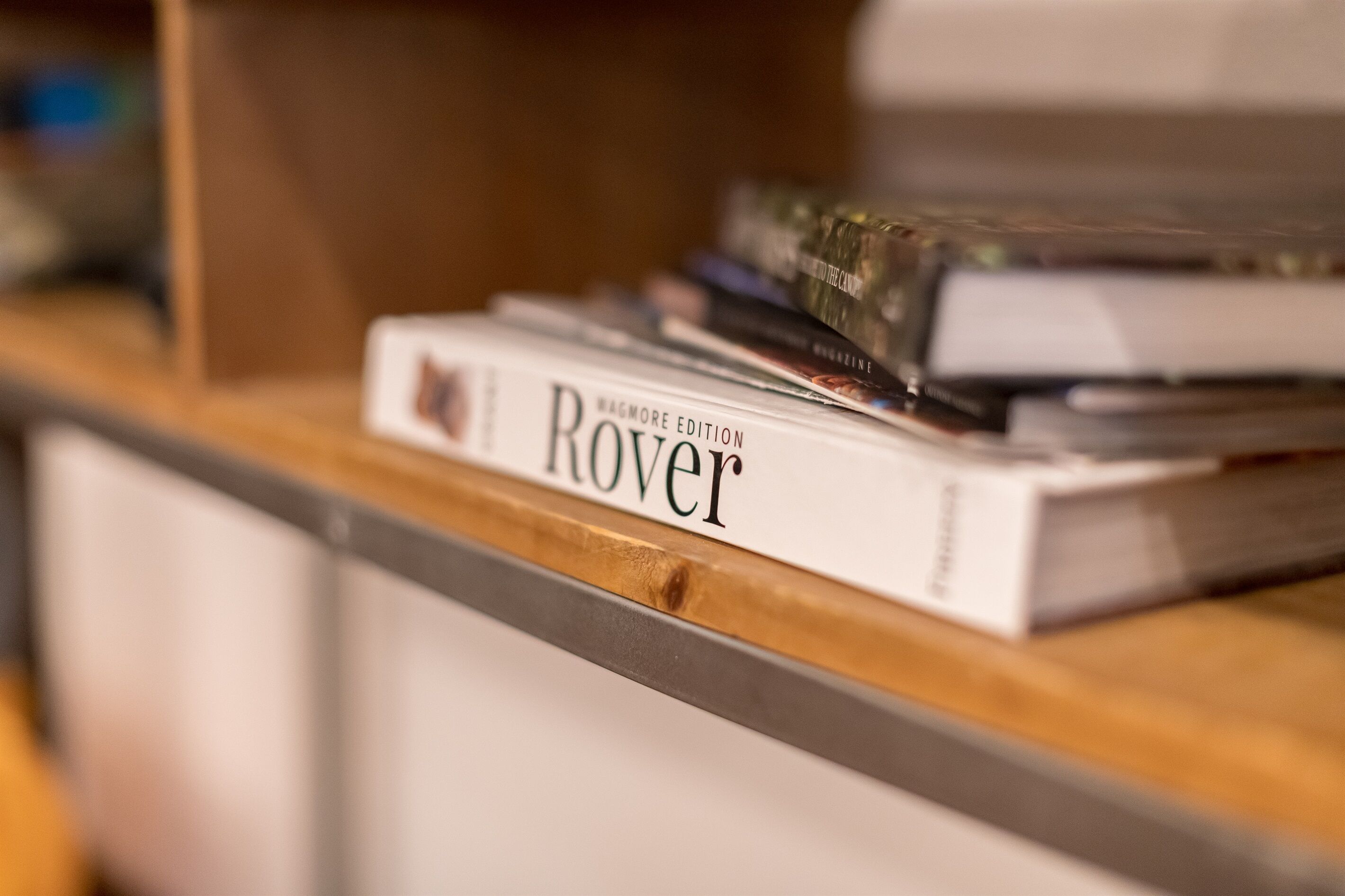 A bookshelf with a book titled 'WAGMORE EDITION Rover'.