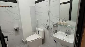 Deluxe Double Room Single Use | Bathroom | Shower, hair dryer, towels, soap