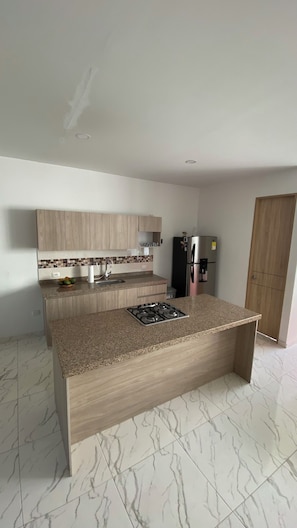 Oven, stovetop, coffee grinder, cookware/dishes/utensils