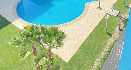 Amira home . Appartement central avec piscine Ă 5 min de la plage