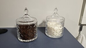 Two glass jars with lids on a dark countertop. - legacy 417 - Cabo Branco (João Pessoa)