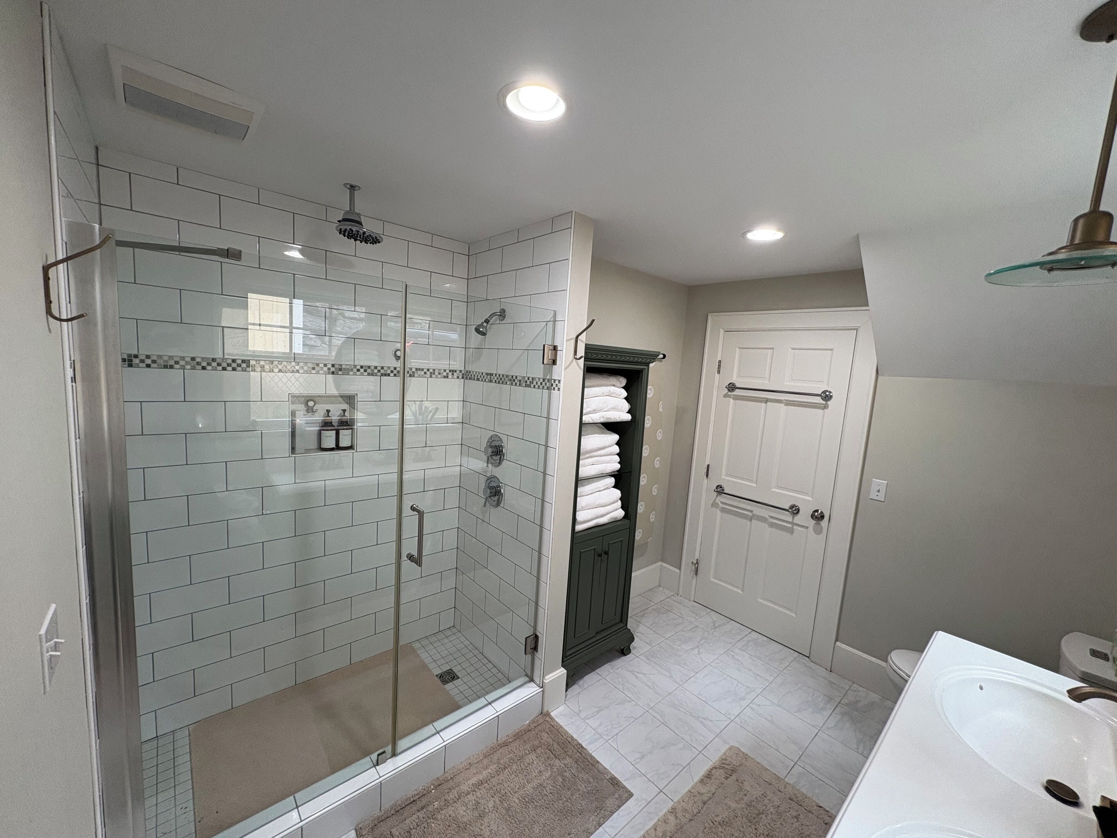 Shower, eco-friendly toiletries, hair dryer, towels