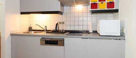 Fridge, stovetop, dishwasher, coffee/tea maker