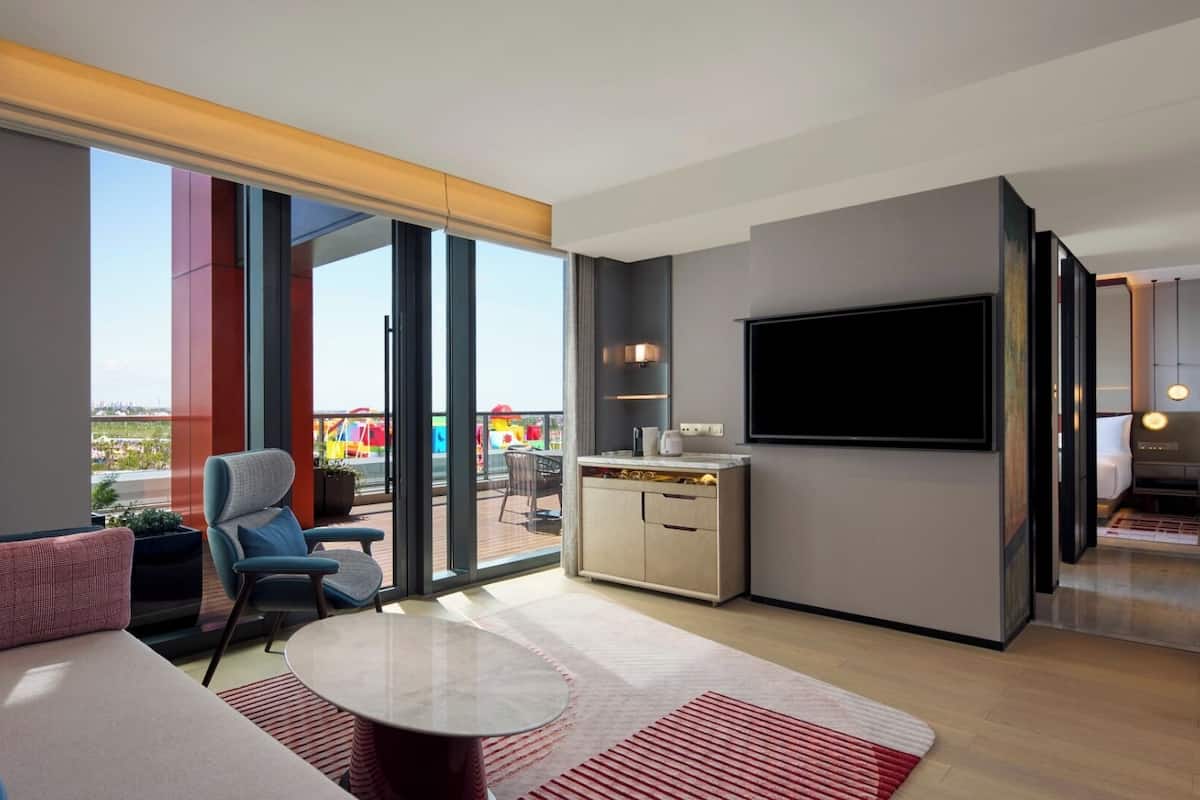 Minibar, desk, blackout curtains, iron/ironing board