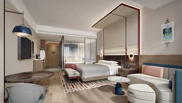 Minibar, escritorio, cortinas blackout y tabla de planchar con plancha