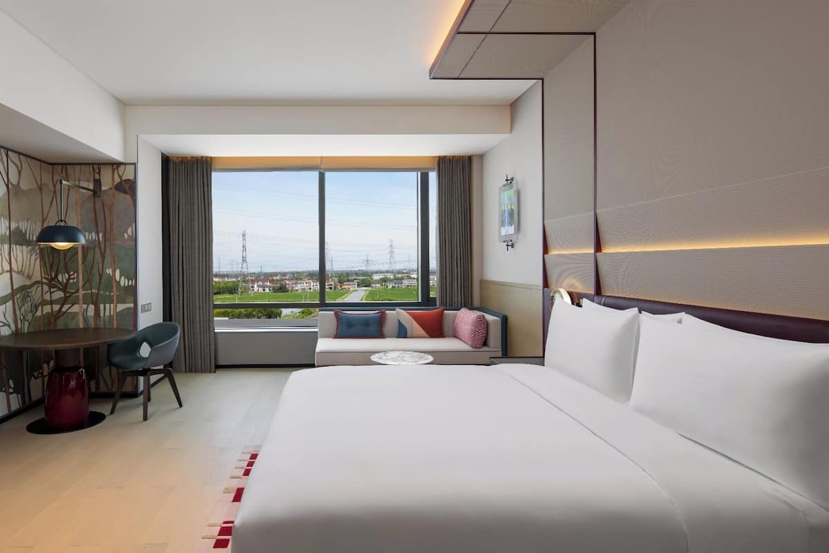 Minibar, desk, blackout curtains, iron/ironing board