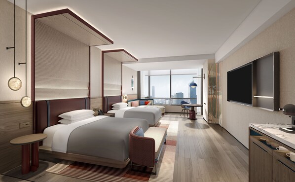 Minibar, escritorio, cortinas opacas y tabla de planchar con plancha
