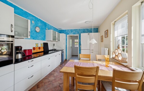 Fridge, stovetop, dishwasher, coffee/tea maker