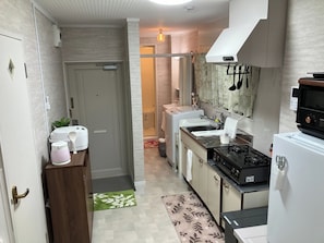 Fridge, microwave, stovetop, cookware/dishes/utensils