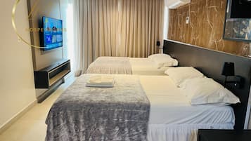 Habitación cuádruple Deluxe | Caja fuerte y wifi gratis