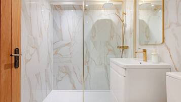 Shower, towels, soap, toilet paper