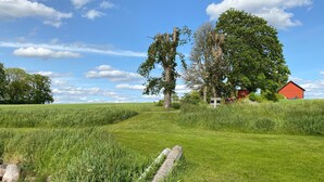 A rural landscape with a red barn, a stone wall, and a field. - 1 bedroom nice apartment in Aneby (Aneby)