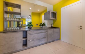 Fridge, stovetop, dishwasher, coffee/tea maker