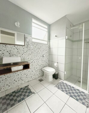 Shower, hair dryer, soap, toilet paper
