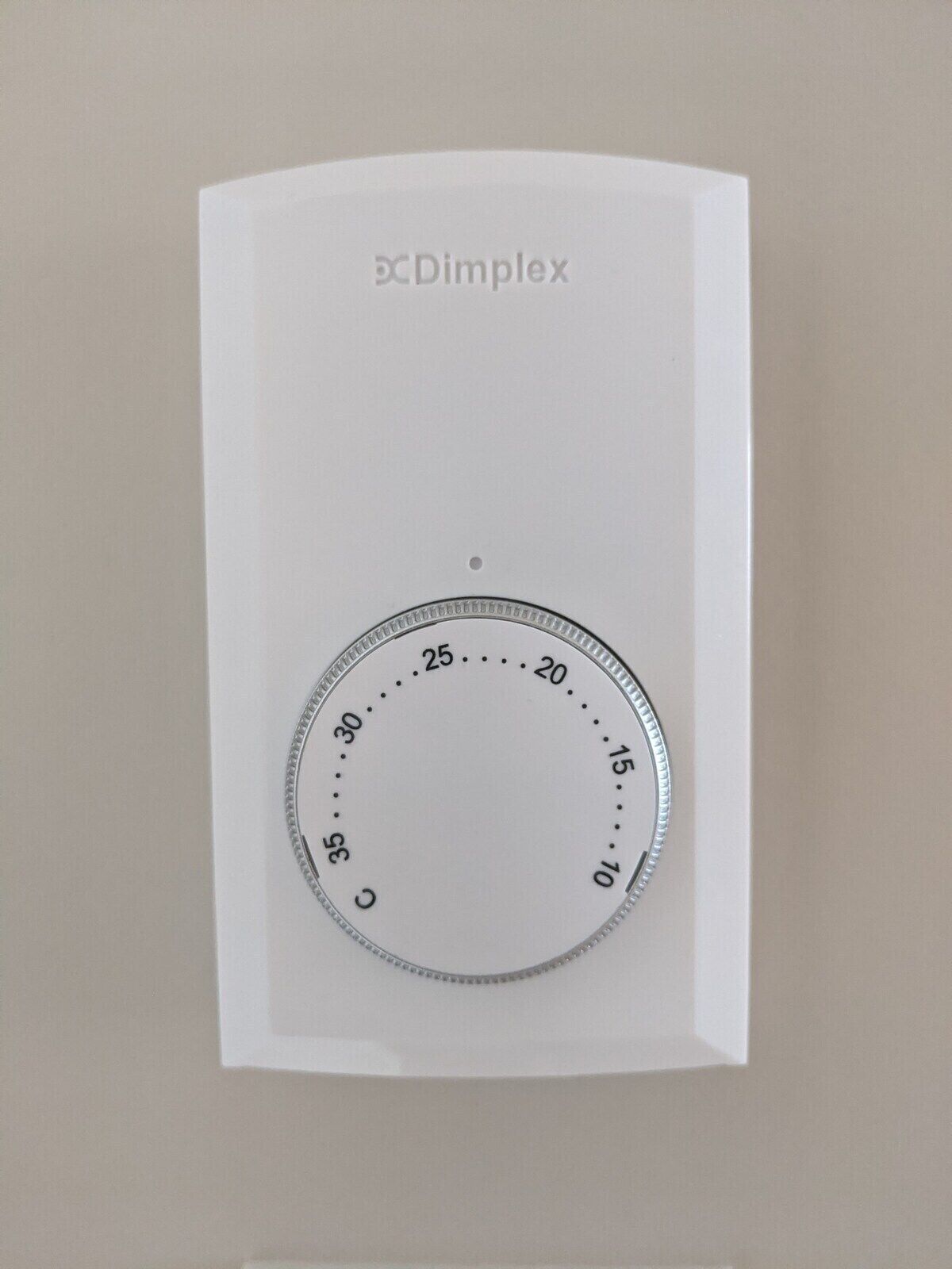 A white paper with a circular diagram and the text "DC Dimplex" on it.