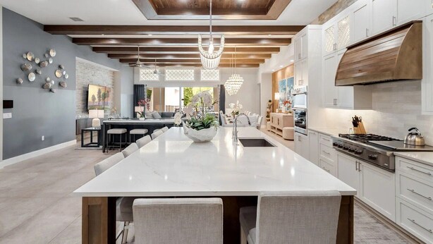 A spacious kitchen with a large island, modern appliances, and a wooden ceiling. - Fairway Tropic Oasis: Themed Bedrooms, Arcade, Basketball Court, Near Disney (Kissimmee)