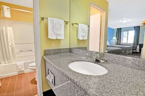 Combined shower/tub, towels, soap, shampoo - Days Inn & Suites by Wyndham Albuquerque West (Albuquerque)