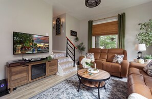 Smart TV, fireplace, books, stereo