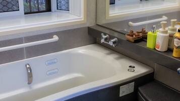 Shower, jetted tub, hair dryer, bidet