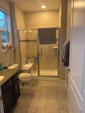 Shower, hair dryer, towels, soap