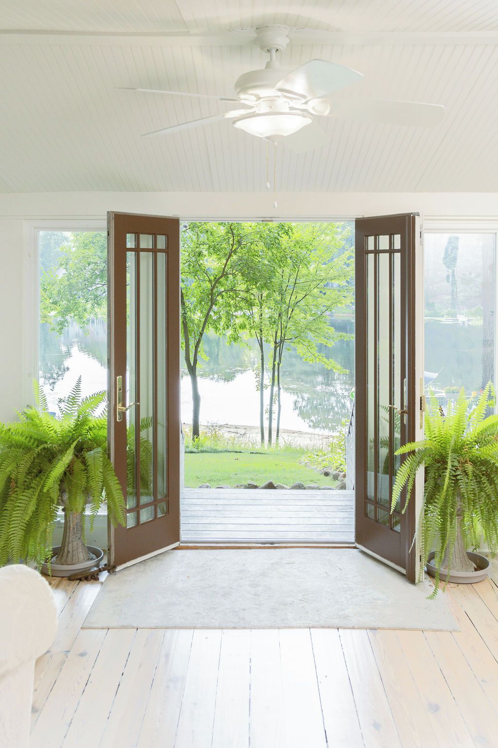 Sun porch with ample seating overlooking lake