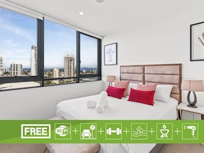 Tabla de planchar con plancha, wifi y ropa de cama