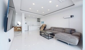 50-inch TV with cable channels, pay movies