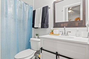 Shower, hair dryer, towels, soap