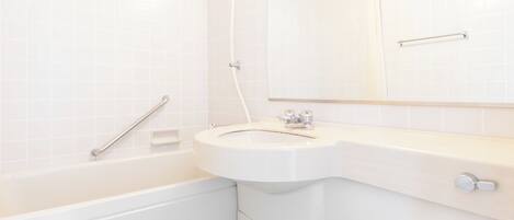 Ein modernes Badezimmer mit einer Badewanne, einem Waschbecken und einer Dusche.
