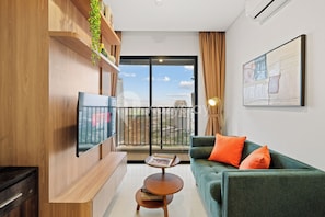 Apartment, 1 Bedroom, City View | Living area | 43-inch Smart TV with cable channels, Netflix, streaming services