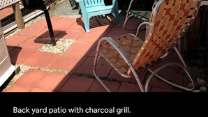 A back yard patio with a charcoal grill. - Cozy Camper North Topsail Beach (North Topsail Beach)