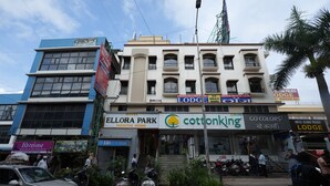 A building with signs for 'Hotel Ellora Park', 'Cottonking', and 'Go Colors'. - Hotel Ellora Park (Pune)