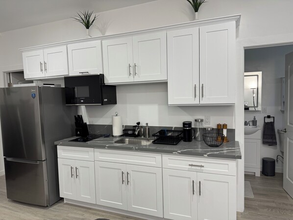 Fridge, microwave, coffee/tea maker, electric kettle