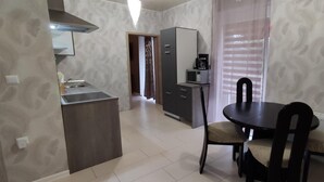 A compact kitchen with a dining area, a microwave, and a coffee maker. - Fürstenhaus and Hofgeismar Center! (Hofgeismar)
