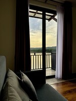 Family Quadruple Room, River View | Desk, laptop workspace, blackout drapes, iron/ironing board