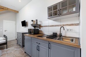 Fridge, microwave, stovetop, coffee/tea maker