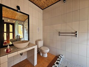 Shower, rainfall showerhead, towels, soap