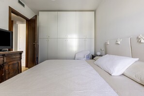 1 bedroom, desk, iron/ironing board, travel cot