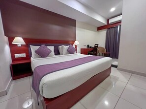 Deluxe Double Room | Living area | 80-cm flat-screen TV with cable channels - Classio Inn Hotel (Bengaluru)