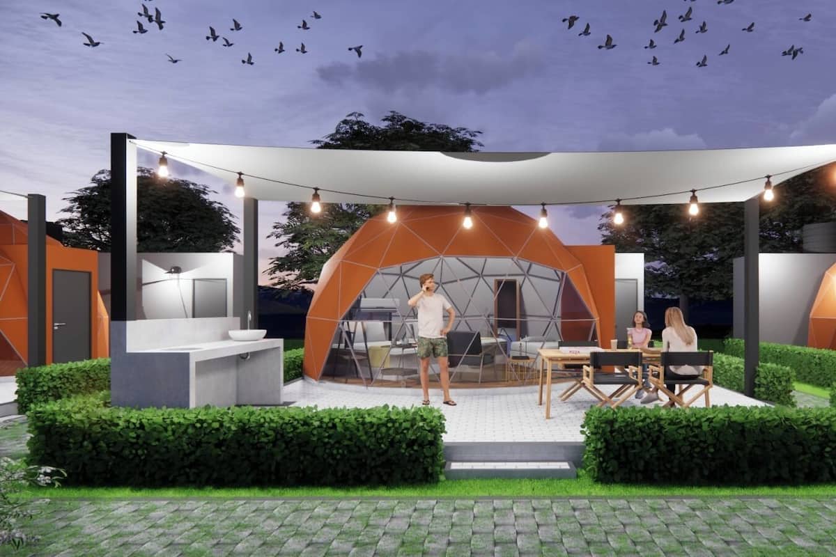An outdoor patio area with a modern design, including a seating area and a bar.