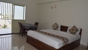 Basic Double Room | Living area | 32-inch Smart TV with cable channels - Sri Darshini Comfort (Mysore)