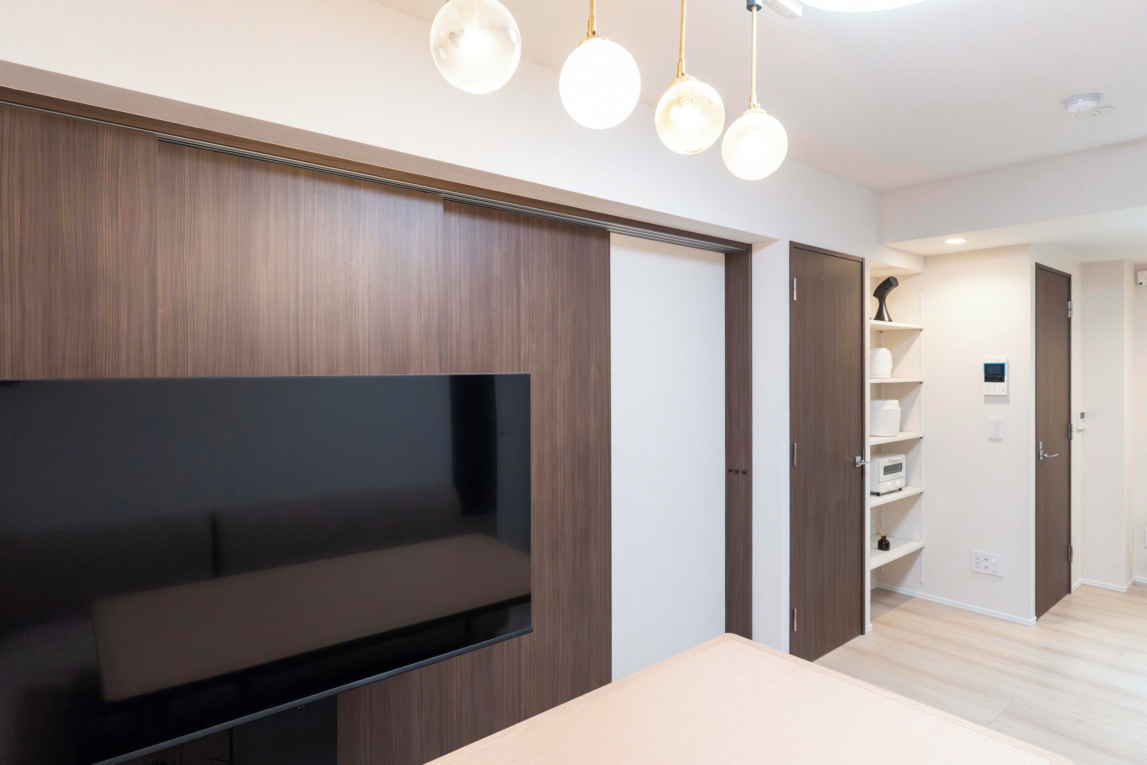 Basic Suite | Living area | 0-inch flat-screen TV with cable channels