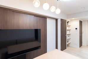 Basic Suite | Living area | 0-inch flat-screen TV with cable channels